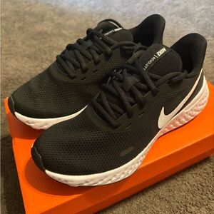 Nike Black Mesh Sneakers with White Swoosh